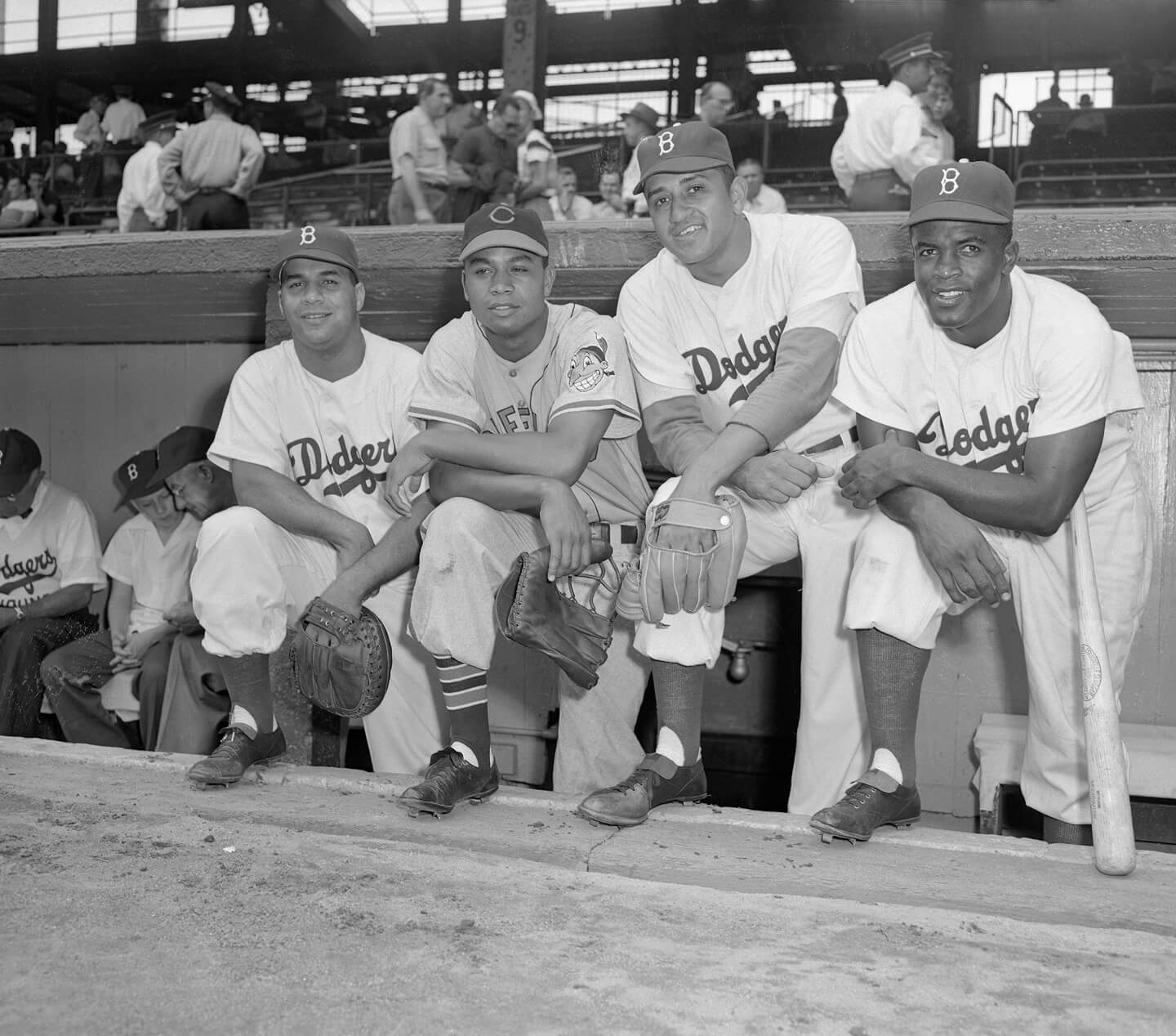 An image of 3 1949 Dodgers Players and their opponent taking a picture