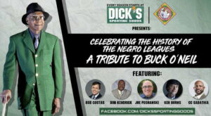 Promotional image for a tribute to Buck ONeil, featuring a man in a green suit and hat. Includes headshots of Bob Costas, Bob Kendrick, Joe Posnanski, Ken Burns, and CC Sabathia, with logos of Dicks Sporting Goods and the Negro Leagues.