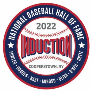 Circular logo for the 2022 National Baseball Hall of Fame Induction in Cooperstown, NY. It features a baseball design with red and blue text. Names around the edge: Fowler, Hodges, Kaat, Miñoso, Oliva, O’Neil, Ortiz.