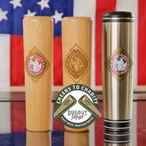 Three baseball-themed mugs are displayed: two wooden and one metal. Each features a National Baseball Hall of Fame emblem. The backdrop is a U.S. flag. A logo reads, Cheers to Charity, Dugout Mugs.