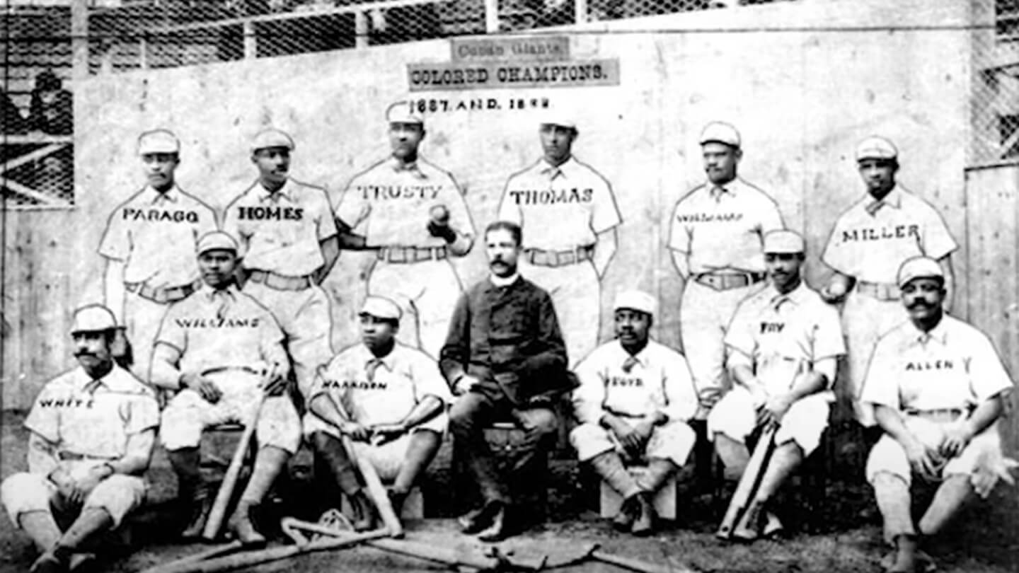 Black and white photo of a Negro Leagues baseball team with handwritten names overlaid