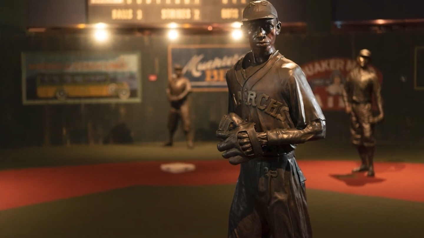 Photo close up of a bronze statue of Satchel Paige that lives inside of the Negro Leagues Baseball Museum
