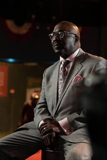 behind the scenes photo of NLBM President, Bob Kendrick, retelling the stories of the Negro Leagues