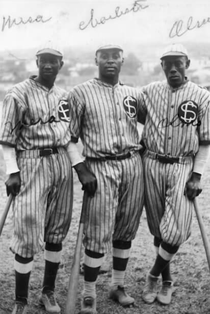 black and white photo of three baseball players standing together, with the names in handwriting above