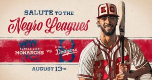 Baseball player in a vintage Kansas City Monarchs uniform holding a bat, with the text Salute to the Negro Leagues, featuring Kansas City Monarchs vs Brooklyn Dodgers and the date August 13th.