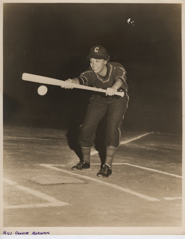 Old photo of Connie Pollock hitting the ball