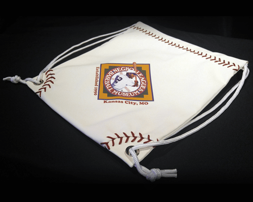 Drawstring bag shaped like a baseball base with stitching design, featuring a logo for the Negro Leagues Baseball Museum, Kansas City, MO.